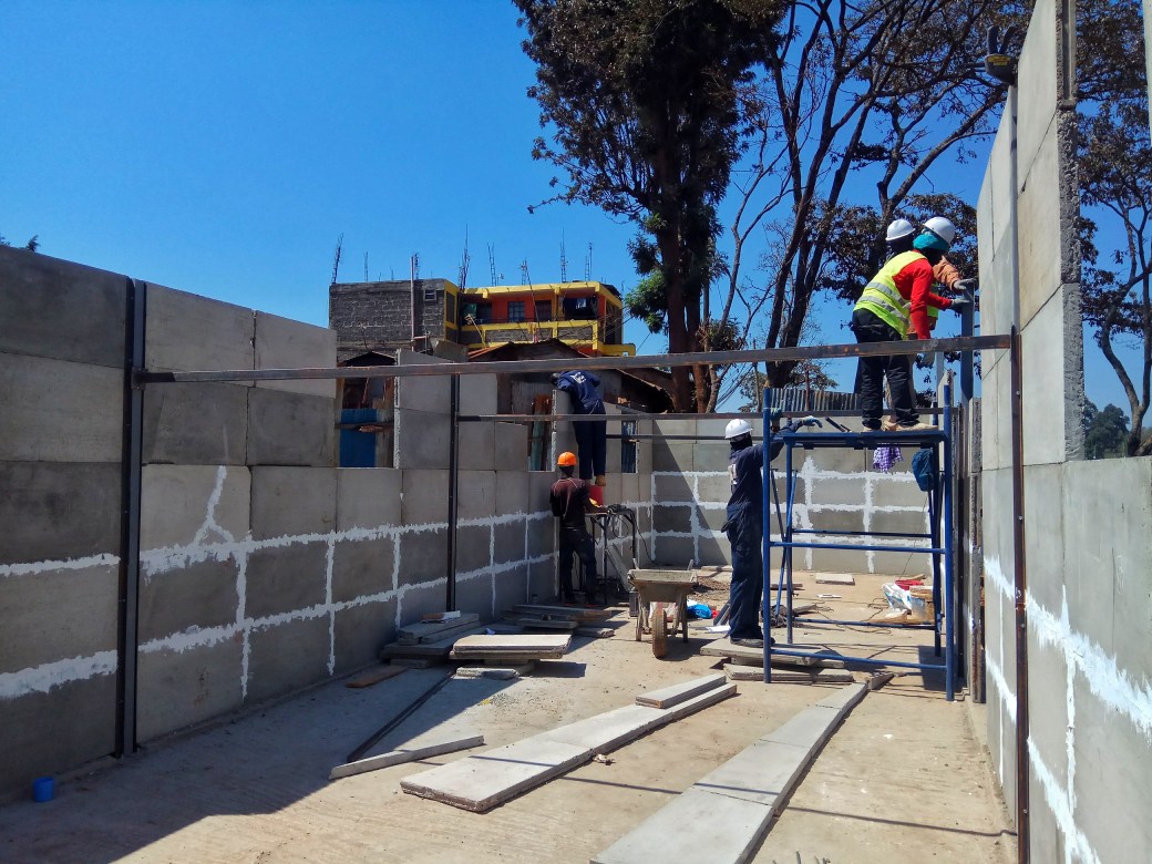 Kwangu Kwako team constructing a school