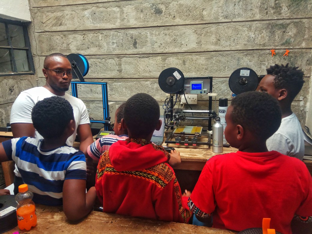 Riddick answers questions from a small class of children
