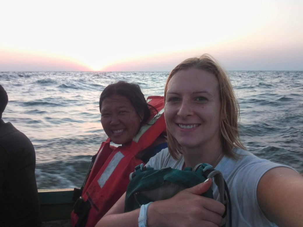 Jodie and I getting splashed with lake water at sunset on the boat ride back to shore