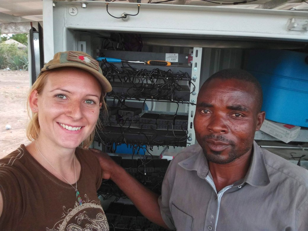 Me with my helper stood in front of the OffGridBox and the powerbank charging cables