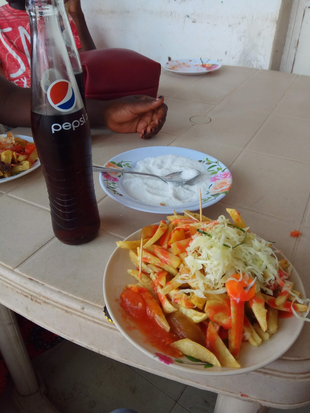 A plate of chips with toothpicks as cutlery