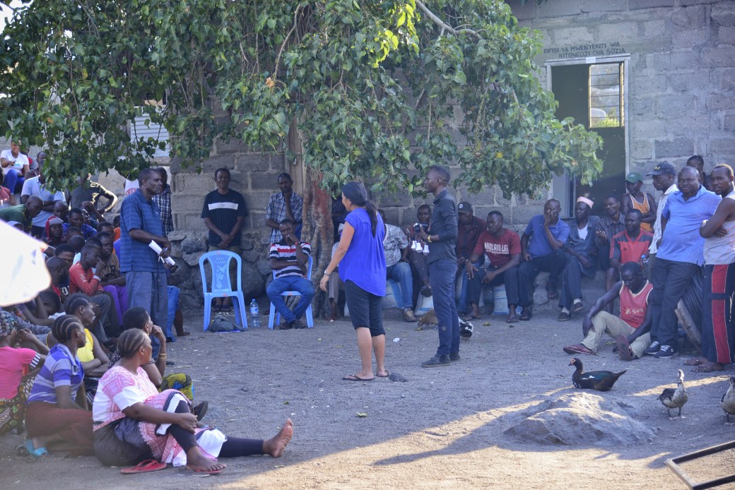 Jodie speaking to the community at a large meeting